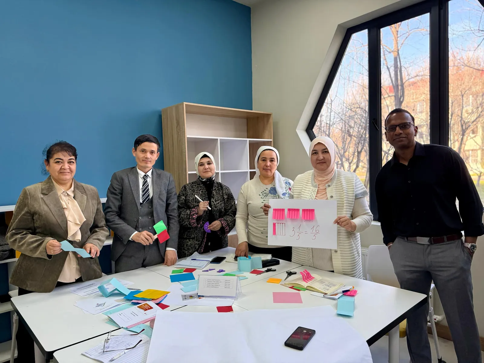 Mr Raj with a group of educators presenting their mathematics work